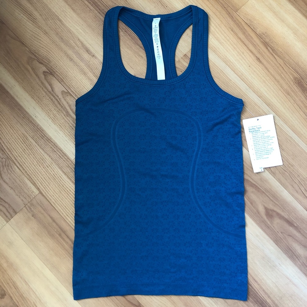 Brand new! Swiftly Tech Racerback Size 4
